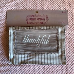 Holiday fall table runner. Written “thankful” with stripes running along